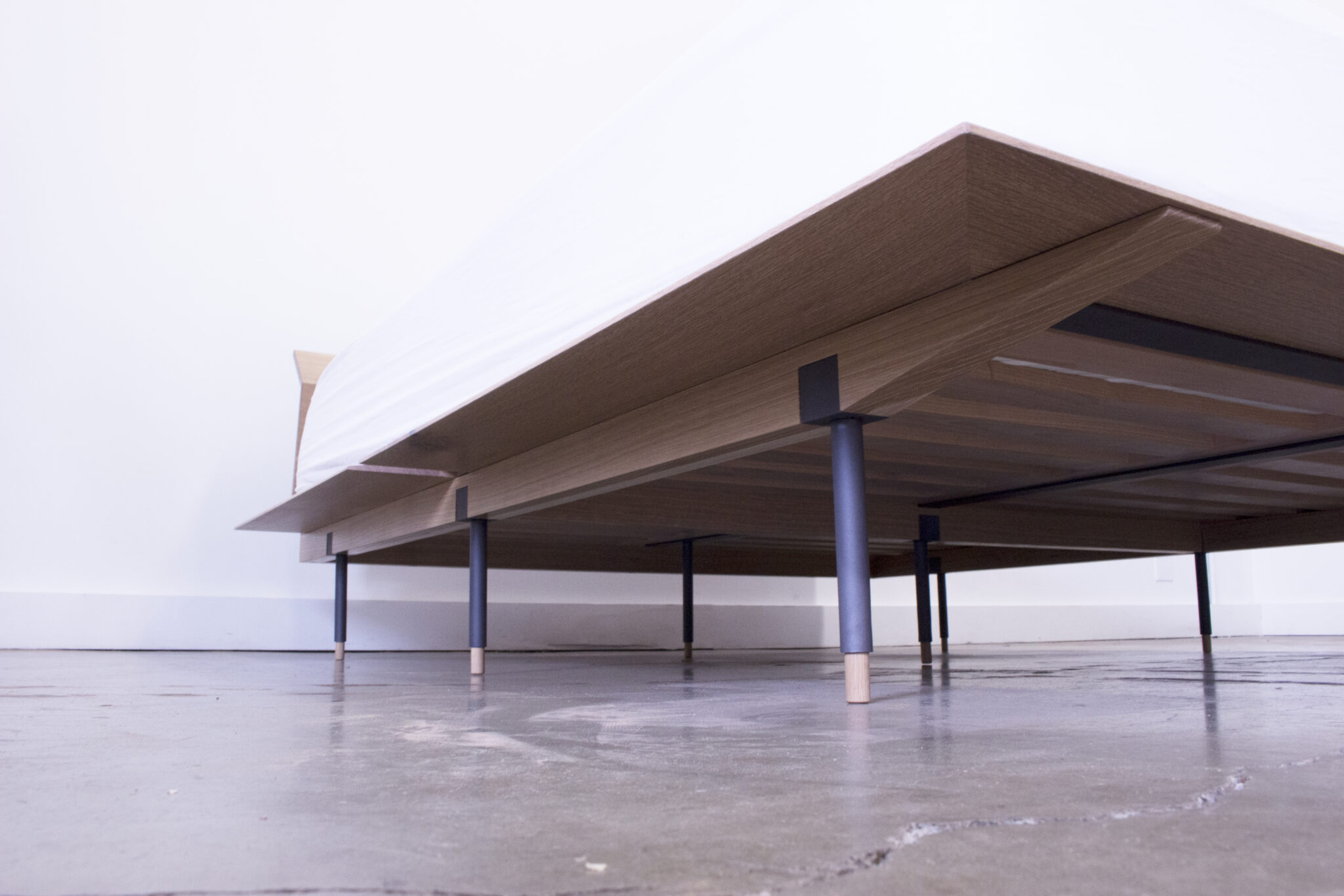 photo of bed frame with mattress.